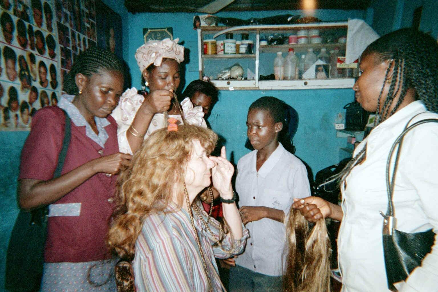 20020905 Susan ready for cornrows to be done in Yaba Marketplace in Lagos Nigeria